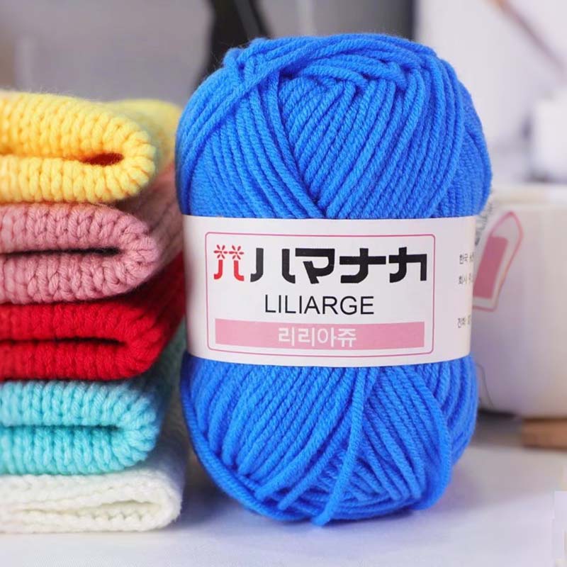 Liliarge DK yarn in vibrant blue, 100% acrylic, with stacked colorful knitting fabric in the background.